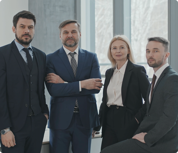 Four attorneys standing together in an office