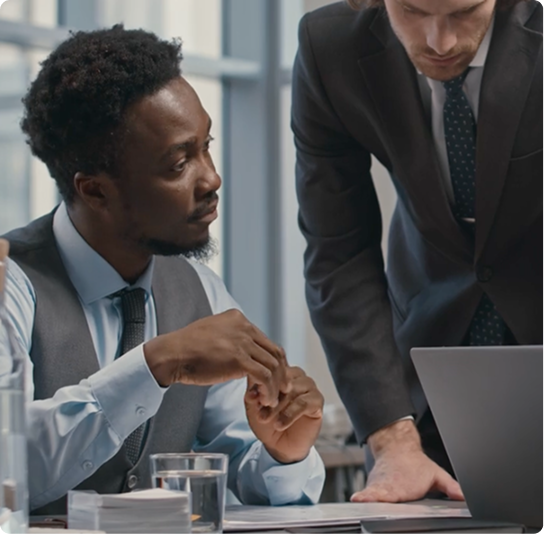 Two attorneys discussing documents in an office